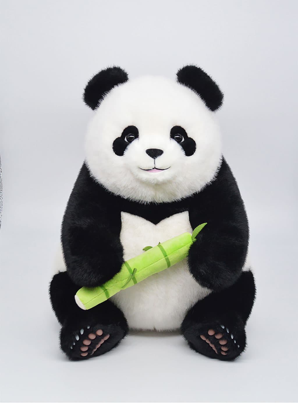 Workout panda Fei Yun holding a pink dumbbell, full view