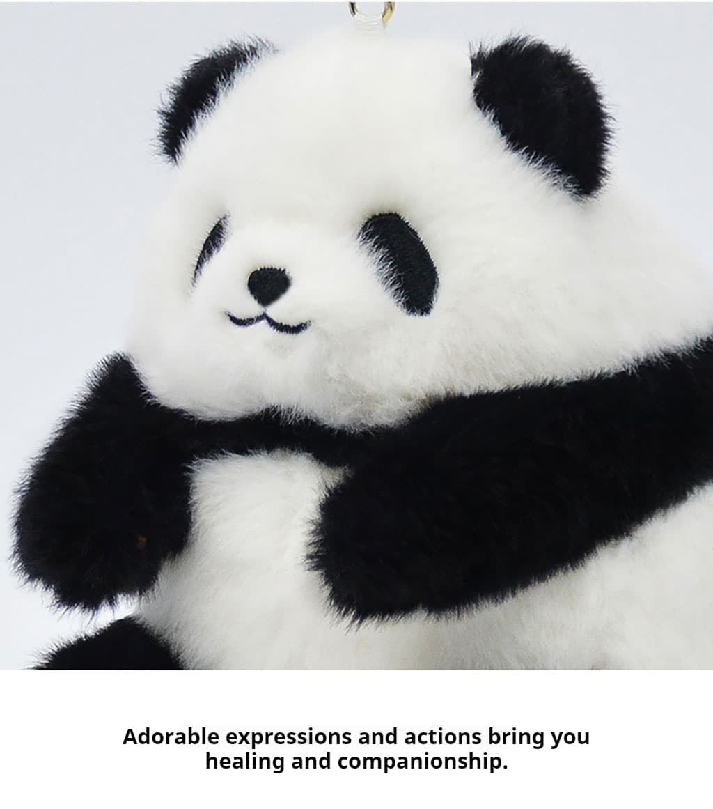 Panda charm hanging on a tote bag